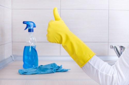 Finchley cleaning specialist carefully restoring a tidy living room